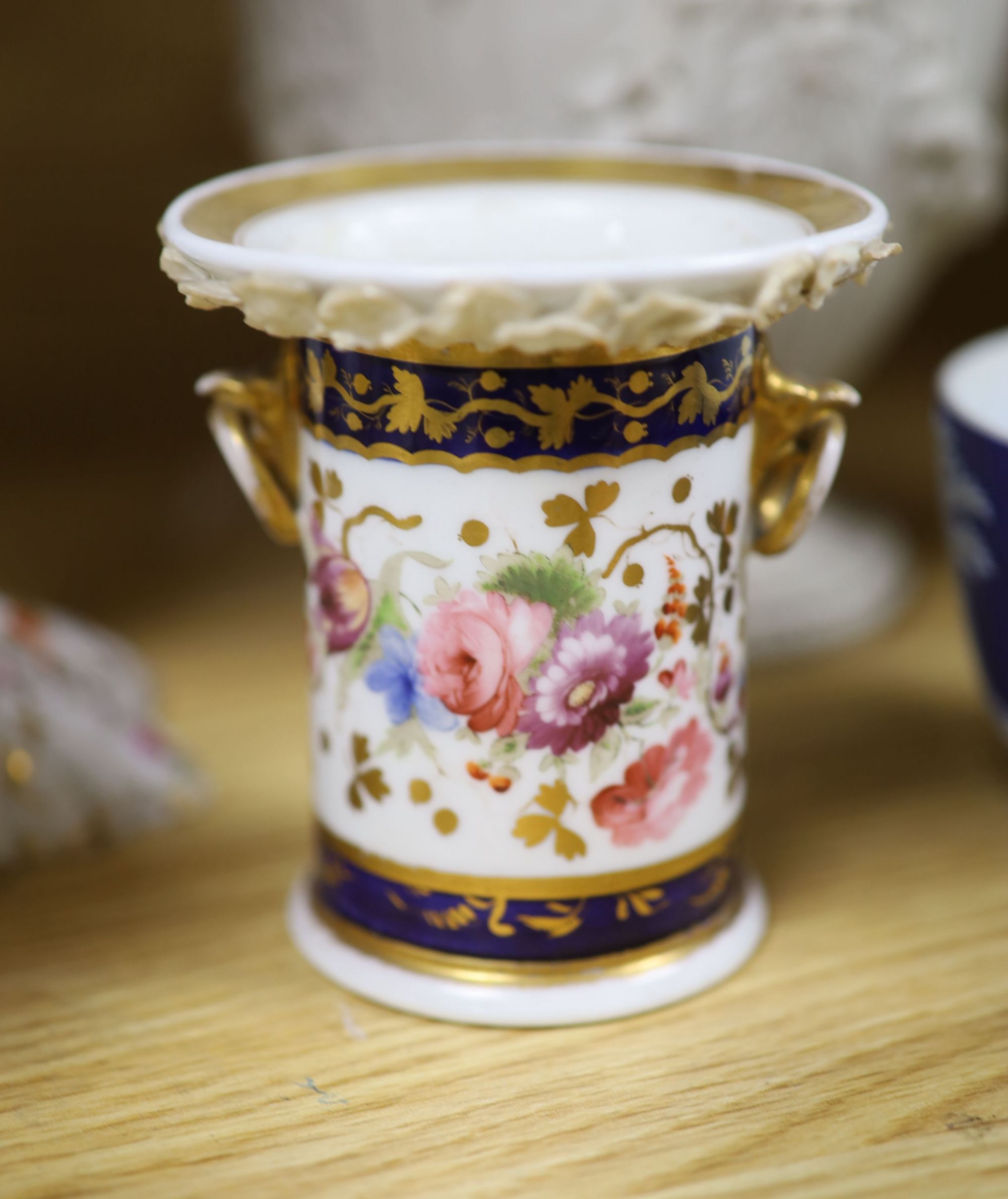 A group of mixed ceramics including a Copeland flower-painted vase, a Staffordshire hen and chick tureen and cover, Staffordshire cot